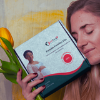 Happy woman holding FertiTerra test kit at home - comfortable and easy fertility testing